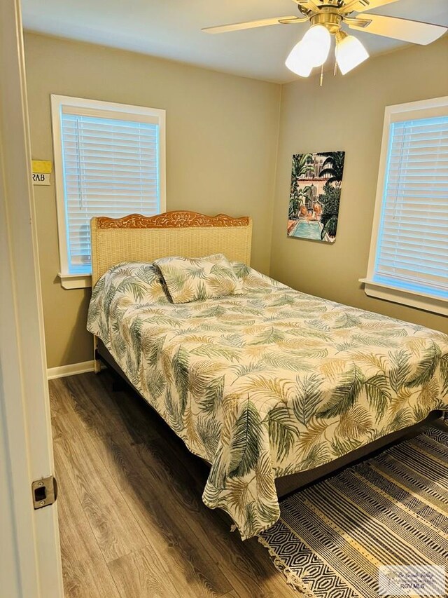 bedroom featuring light hardwood / wood-style flooring and ceiling fan