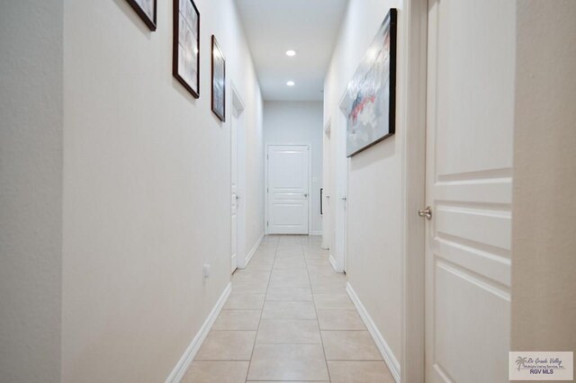 hallway with light tile patterned flooring