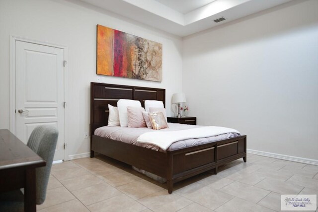 bedroom featuring light tile patterned floors