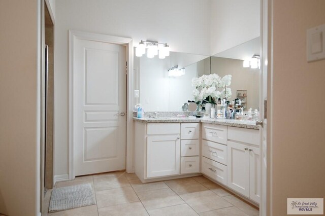 bathroom featuring tile patterned floors and vanity