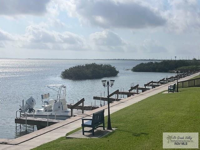 77 Santa Isabel Blvd Unit K1, Laguna Vista, TX 78578 - dock area with a lawn and a water view