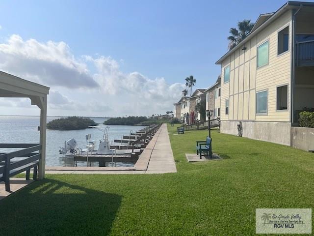 77 Santa Isabel Blvd Unit K1, Laguna Vista, TX 78578 - dock area with a water view and a lawn