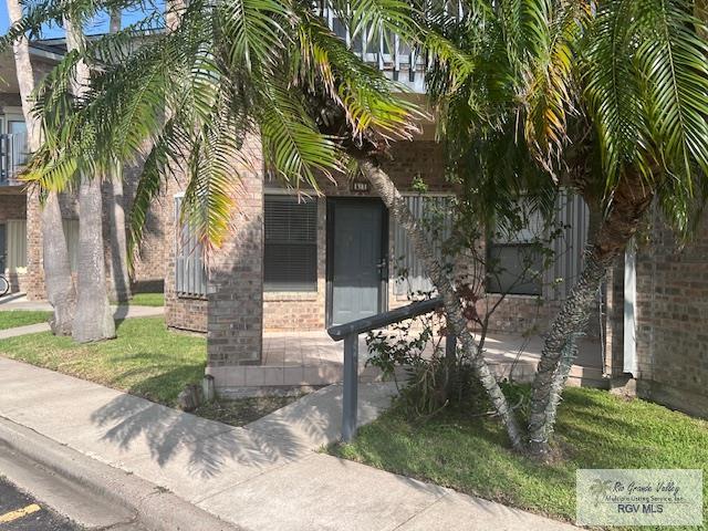 77 Santa Isabel Blvd Unit K1, Laguna Vista, TX 78578 - view of side of property featuring brick siding