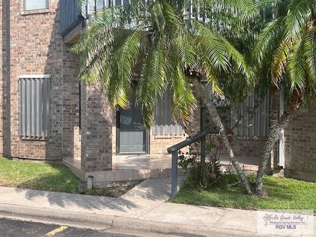 77 Santa Isabel Blvd Unit K1, Laguna Vista, TX 78578 - entrance to property featuring brick siding