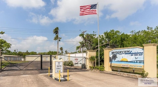 77 Santa Isabel Blvd Unit K1, Laguna Vista, TX 78578 - view of concrete road with a gate and a gated entry
