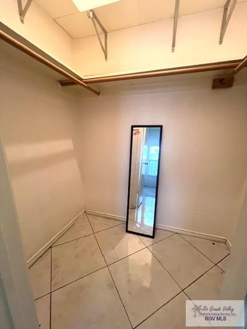 77 Santa Isabel Blvd Unit K1, Laguna Vista, TX 78578 - walk in closet with light tile patterned flooring