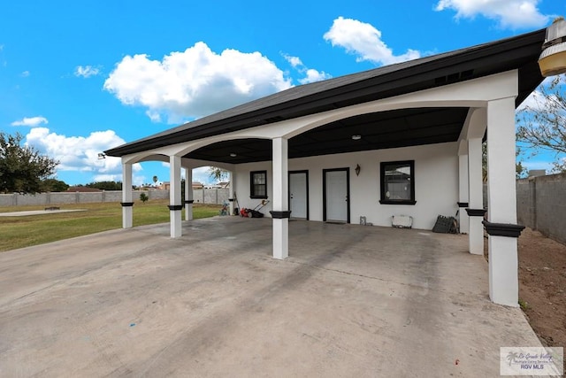 exterior space with a yard and a carport