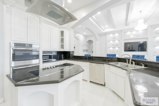 kitchen featuring backsplash, white cabinets, beam ceiling, appliances with stainless steel finishes, and island range hood