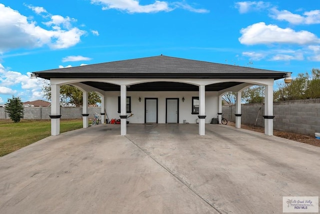 exterior space featuring a carport