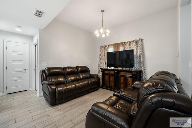 4438 Mckenzie Rd, Brownsville, TX 78521 - living room featuring a chandelier and light wood-style floors