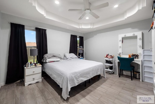 4438 Mckenzie Rd, Brownsville, TX 78521 - bedroom with a raised ceiling, light wood-style floors, recessed lighting, and a ceiling fan