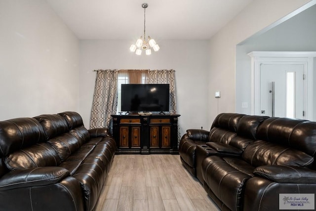 4438 Mckenzie Rd, Brownsville, TX 78521 - living room featuring a chandelier and light wood finished floors