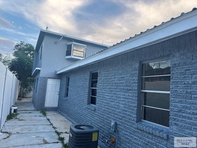 view of home's exterior with central AC unit