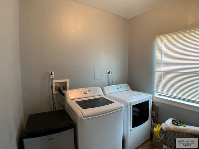 clothes washing area featuring independent washer and dryer