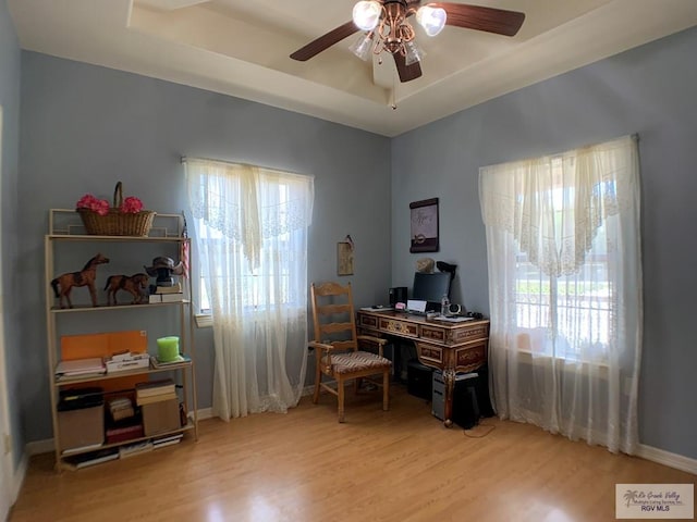 office space featuring wood-type flooring and ceiling fan