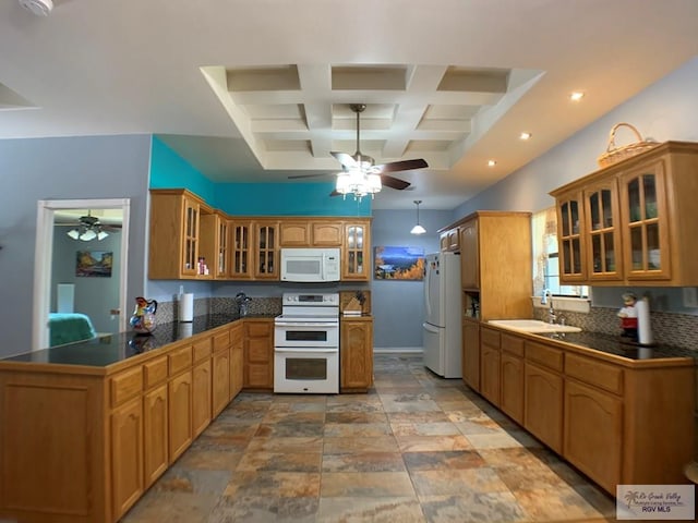 kitchen featuring sink, coffered ceiling, backsplash, kitchen peninsula, and white appliances