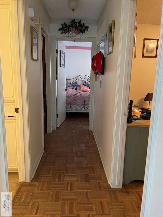 hall featuring dark parquet flooring