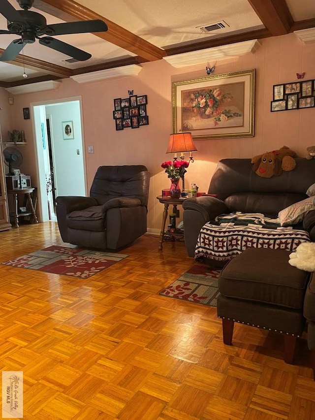 living room with ceiling fan, light parquet flooring, and beamed ceiling