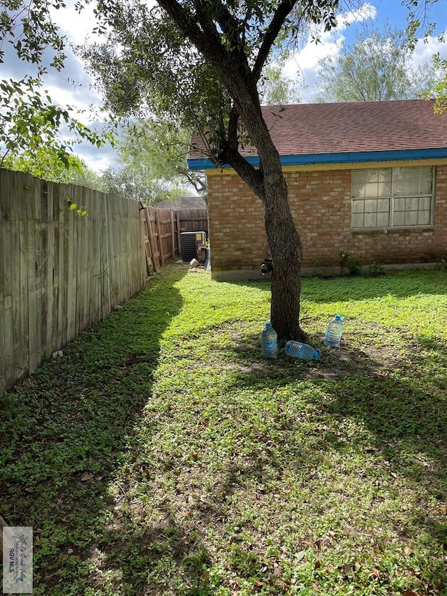 view of yard with central AC unit