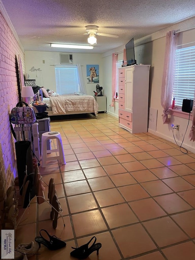 tiled bedroom with ceiling fan, crown molding, and a textured ceiling