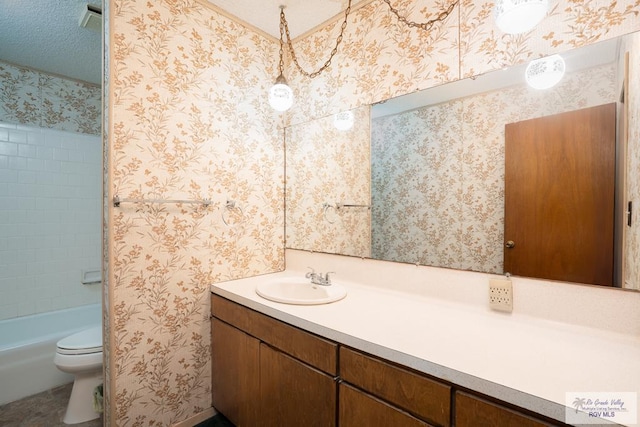 19863 Tilden Rd, San Benito, TX 78586 - bathroom featuring vanity, toilet, and bathing tub / shower combination