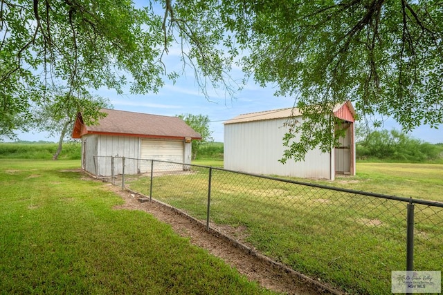 19863 Tilden Rd, San Benito, TX 78586 - view of yard with an outbuilding, a detached garage, and a pole building