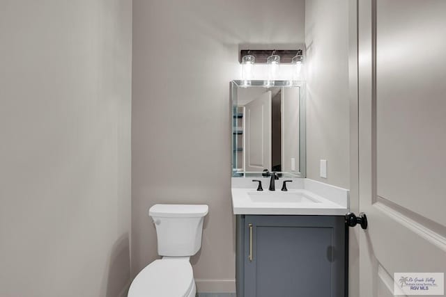 half bath with toilet and vanity