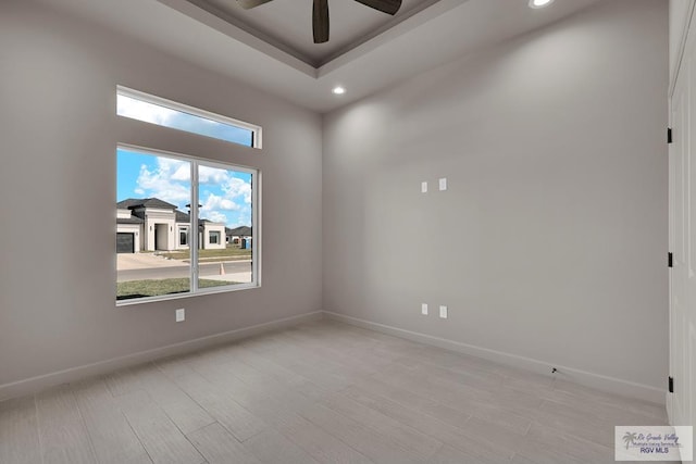 unfurnished room with ceiling fan, baseboards, light wood-style flooring, and recessed lighting