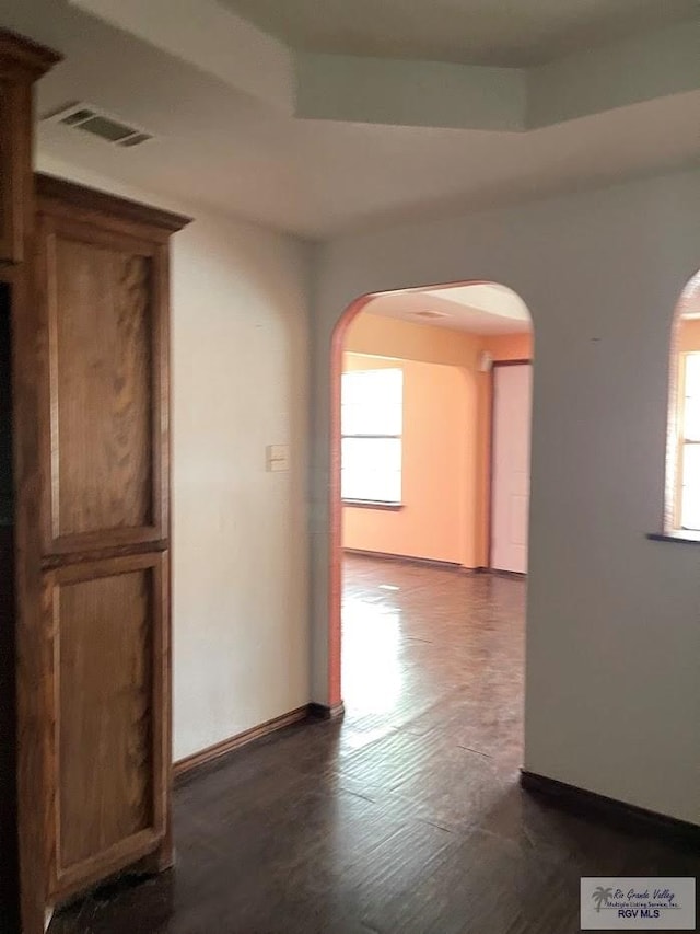 hall with dark hardwood / wood-style flooring