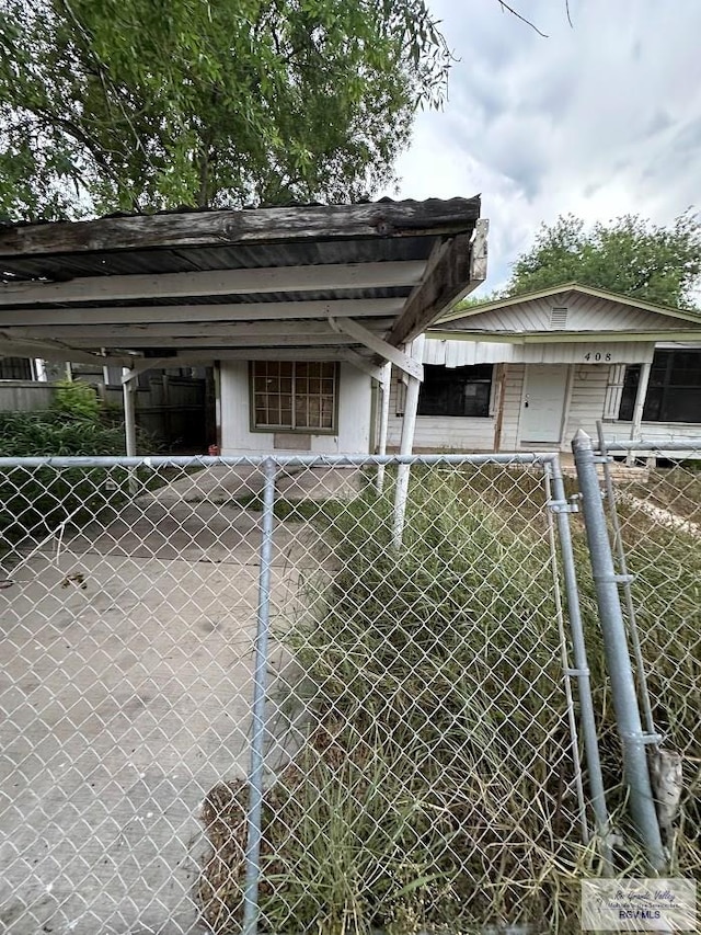 408 W 6th St, La Feria, TX 78559 - view of vehicle parking with a carport