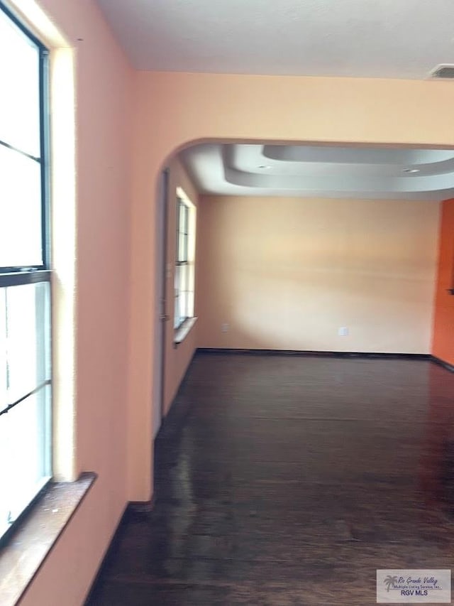 408 W 6th St, La Feria, TX 78559 - corridor featuring wood finished floors and arched walkways