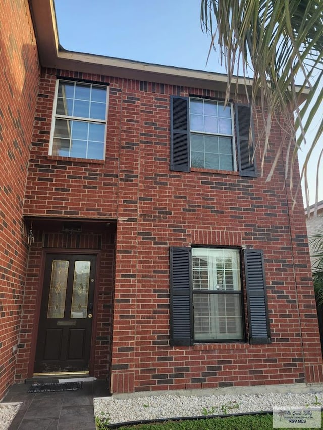 1056 Vamonos Dr, Brownsville, TX 78526 - view of front of home featuring brick siding and french doors