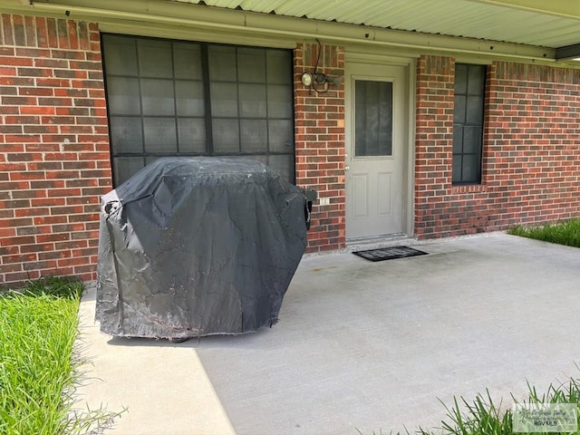810 E Robin Ave Unit 53, Harlingen, TX 78550 - view of exterior entry featuring brick siding
