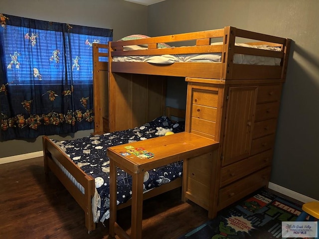 810 E Robin Ave Unit 53, Harlingen, TX 78550 - bedroom featuring baseboards and wood finished floors