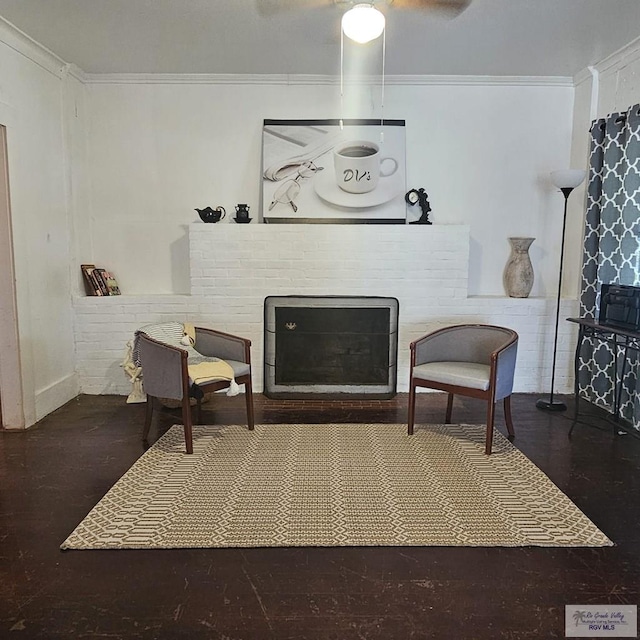 sitting room with a fireplace and crown molding