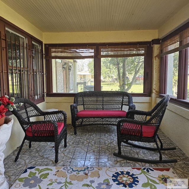 sunroom featuring wooden ceiling