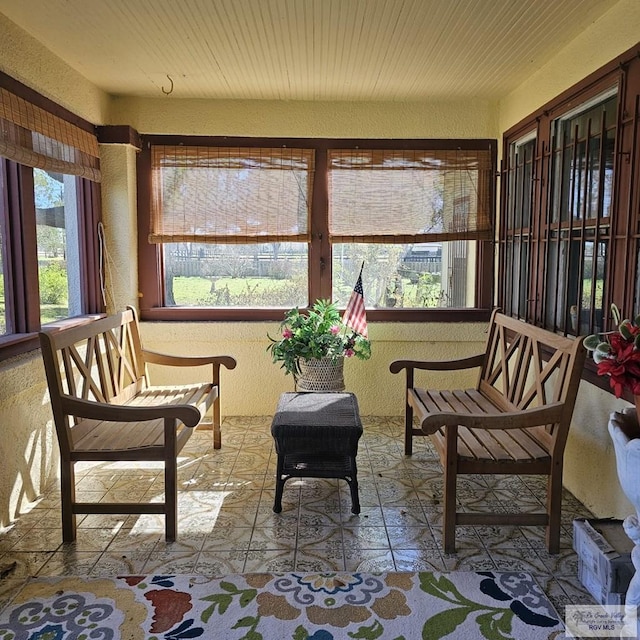 sunroom featuring wooden ceiling