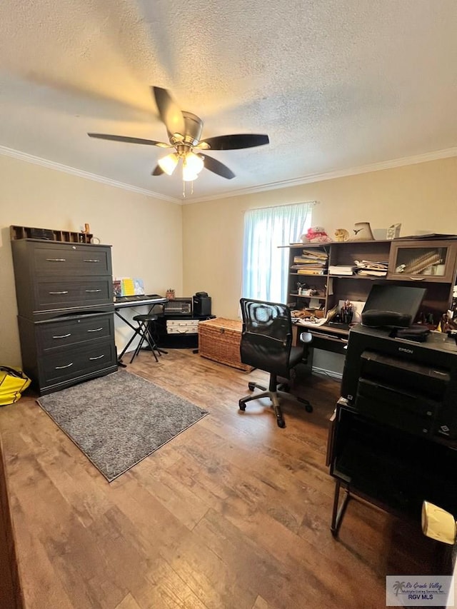 office space featuring ceiling fan, crown molding, a textured ceiling, and hardwood / wood-style flooring