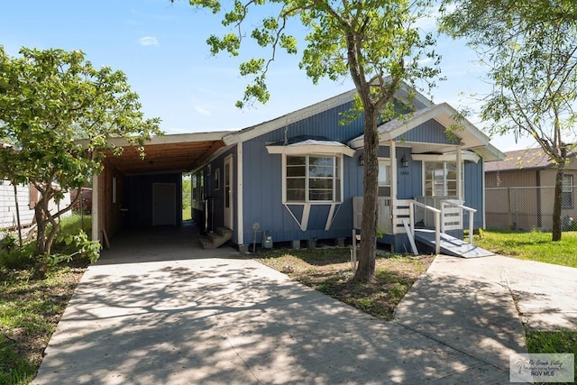 view of front of property with a carport