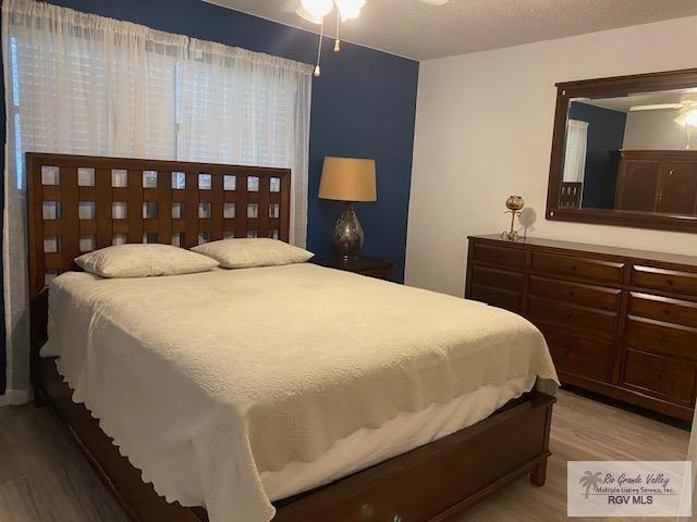 bedroom with wood-type flooring