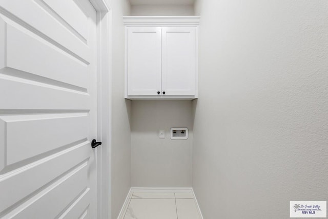 washroom with cabinets and washer hookup