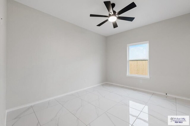 spare room featuring ceiling fan