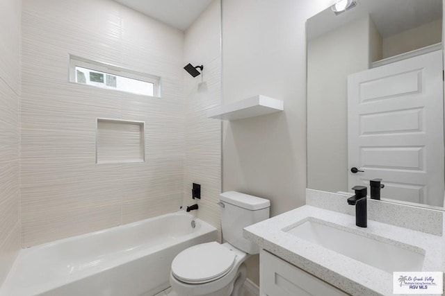 full bathroom with vanity, toilet, and tiled shower / bath combo