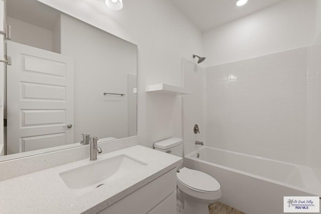 full bathroom featuring vanity, shower / bathtub combination, and toilet