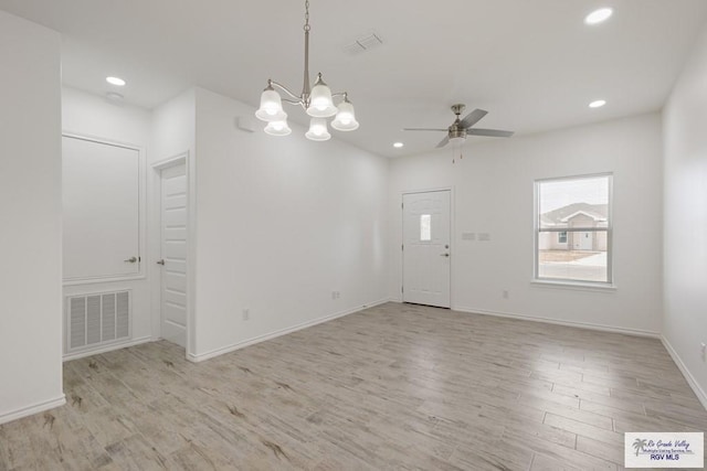 empty room featuring ceiling fan and light hardwood / wood-style flooring