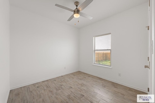 spare room featuring ceiling fan and light hardwood / wood-style floors