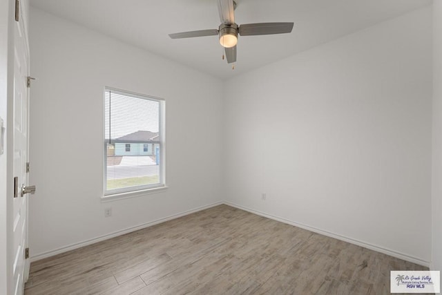 spare room with ceiling fan and light hardwood / wood-style floors