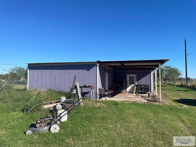 view of outdoor structure with a lawn