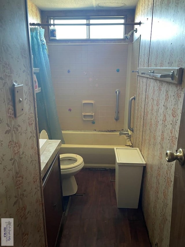 full bathroom with shower / tub combo, vanity, hardwood / wood-style flooring, and toilet