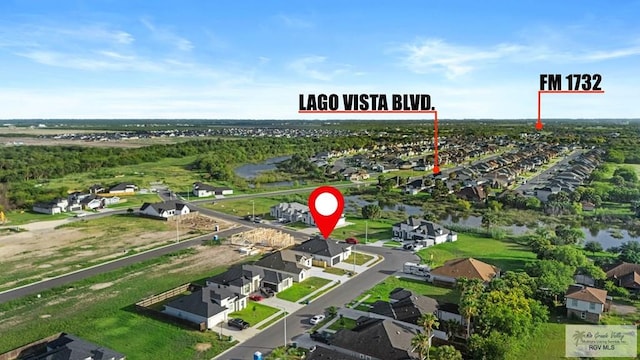 7332 San Andres St, Brownsville, TX 78520 - aerial view of property and surrounding area featuring nearby suburban area and a large body of water